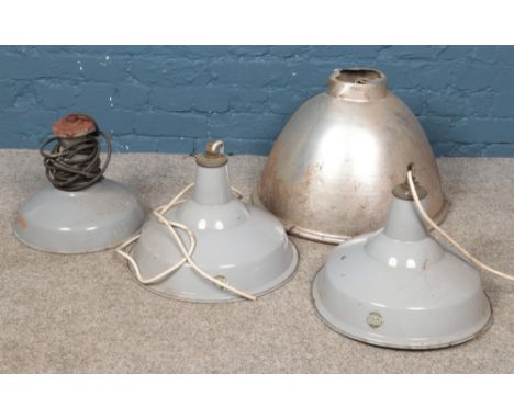 Four industrial light shades. Including two Benjamin and an aluminium example.  