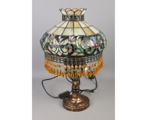 A Tiffany style table lamp featuring beaded fringe decoration to shade.  Good condition.