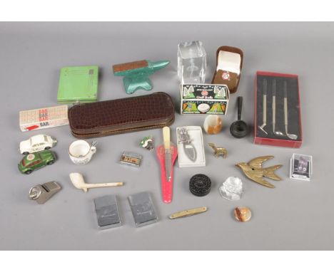 A quantity of collectables to include brass figures, Dunlop Golf Balls, Rolls Razor, etc.  