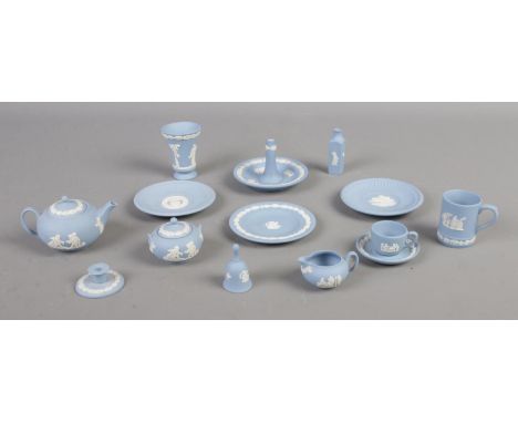 A quantity of Wedgwood miniatures in sky blue jasperware. To include cup and saucer, candlestick, teapot and lidded bowl etc.