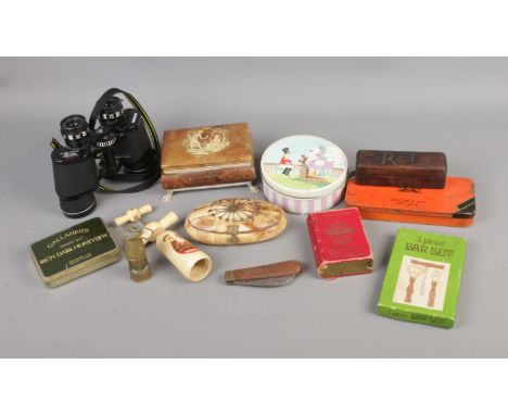 A quantity of collectables to include corkscrews, vintage tins, binoculars, etc.  