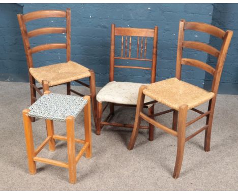 A pair of rush seat ladder back chairs along with a small chair and stool.  