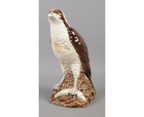 A Whyte and Mackay Royal Doulton novelty Osprey decanter.  Seal is leaking. Ceramic in good condition.