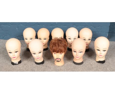 A box of vintage mannequin display heads.  