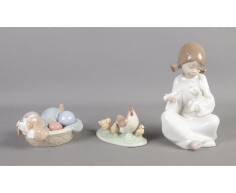 Three boxed Nao by Lladro figures to include 01275: Tomatelo Todo, 01406: Dozing Doggy and 01047: Gallina Con Polluelos.  