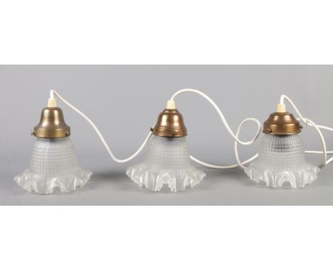 Three vintage light fittings, with frilled glass shades.  