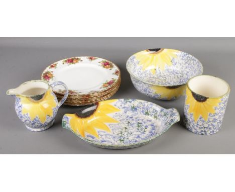 A collection of ceramics. Includes Royal Albert Old Country Roses and Poole sunflower.  