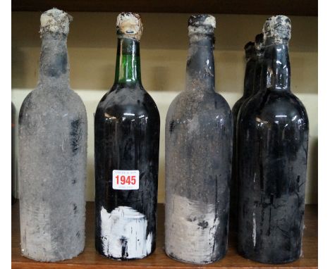 Seven bottles of Graham's 1963 vintage port, (lacking labels). Condition Report: Ullage as follows:
1 (with lot number) - bet