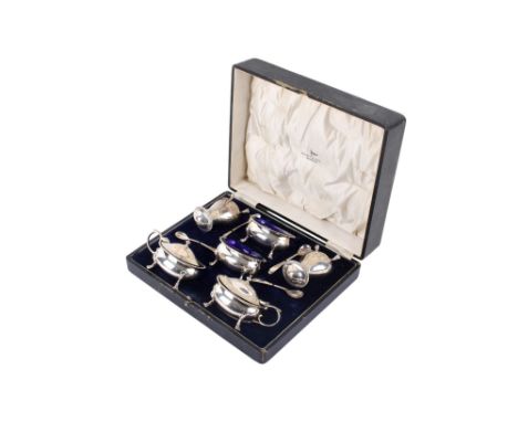 A George V silver Walker & Hall boxed condiment set. Hallmarked London 1933, comprising two condiment pots, two shakers, two 