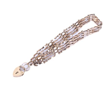 A 9ct gold gate link bracelet with heart clasp. Hallmarked, L18cm, weight 6.3g. 
