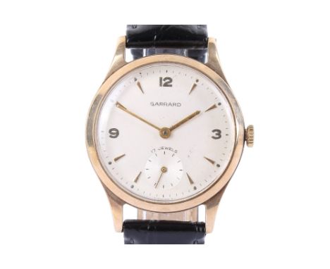 A gentleman's 9ct gold cased Garrard watch. White dial with mixed markings and small seconds function, mechanical movement. D