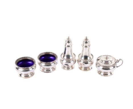 A George V silver five piece condiment set. Comprising two shakers, a condiment pot and two open salts with blue enamel inter