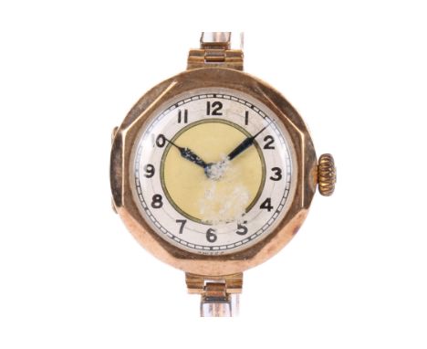 A vintage 9ct gold lady's wristwatch. Black Arabic numbers to the yellow and white face, the octagonal case hallmarked to the
