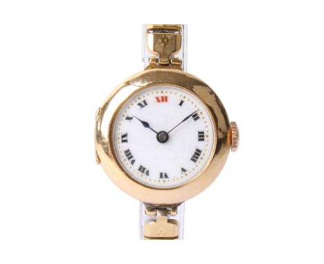 An 18ct gold cased lady's wristwatch. With black and red Roman numerals and gilt second markers to a white face, the inside o