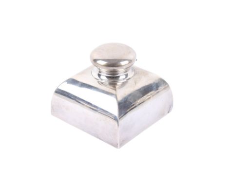 An Edwardian silver inkwell. Maker William Comyns & Sons, London 1902, of tapered square form with a circular hinged stopper 