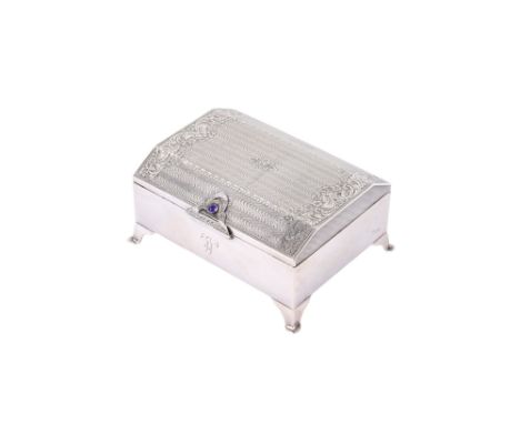 A George V silver trinket box. Maker Henry Matthews, Birmingham 1928, of rectangular form with engraved floral decoration to 