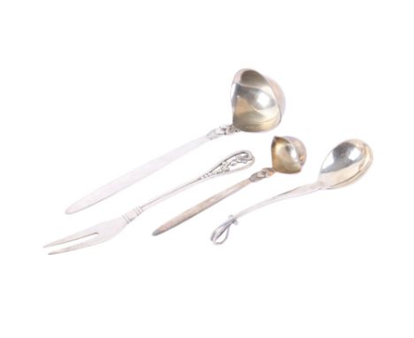 Four pieces of Georg Jensen flatware. Comprising a large and small ladle in the 'Cactus' pattern, a caddy spoon with a curved