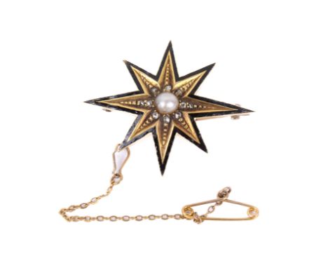 A Victorian yellow metal and black enamel star brooch. The central half pearl surrounded by small diamonds within an eight-po