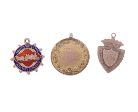 Three 9ct gold pendants. Comprising one for the 'Rhodesia Amateur Boxing Championship 1911, Heavy Weight', in a gold plated c