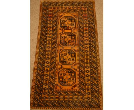 Bokhara gold ground rug, 184cm x 100cm  Condition Report Click here for further images, condition, auction times & delivery c