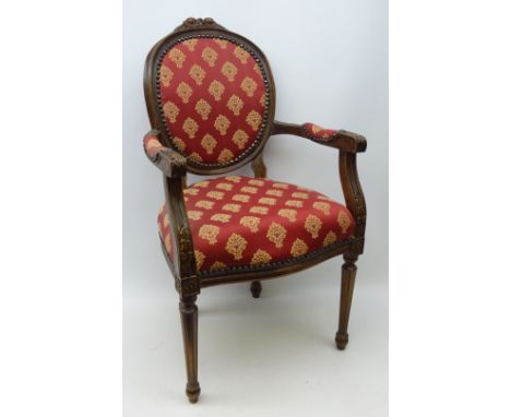 Louis XVI French style beech framed child's armchair, floral carved cresting rail, on turned and fluted supports, upholstered