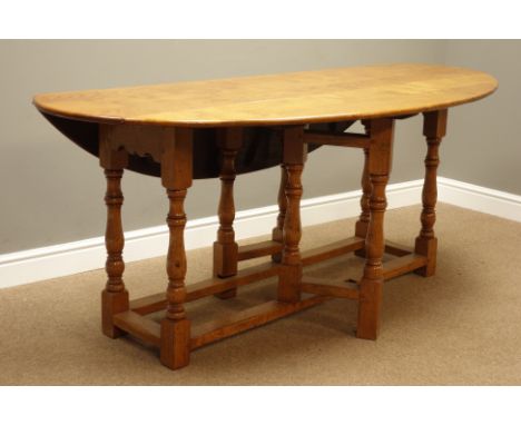 18th century style light oak wake table, oval drop leaf top, on gate leg action base with turned supports, W183cm x D105cm, H