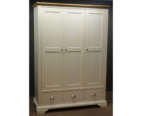 Rodgers of York ivory and oak finish triple wardrobe, two internal hanging rails, one shelf, three drawers, bracket feet, W13