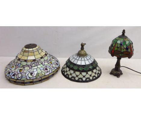 Two Tiffany style hanging light shades and a Tiffany style desk light  Condition Report Click here for further images, condit