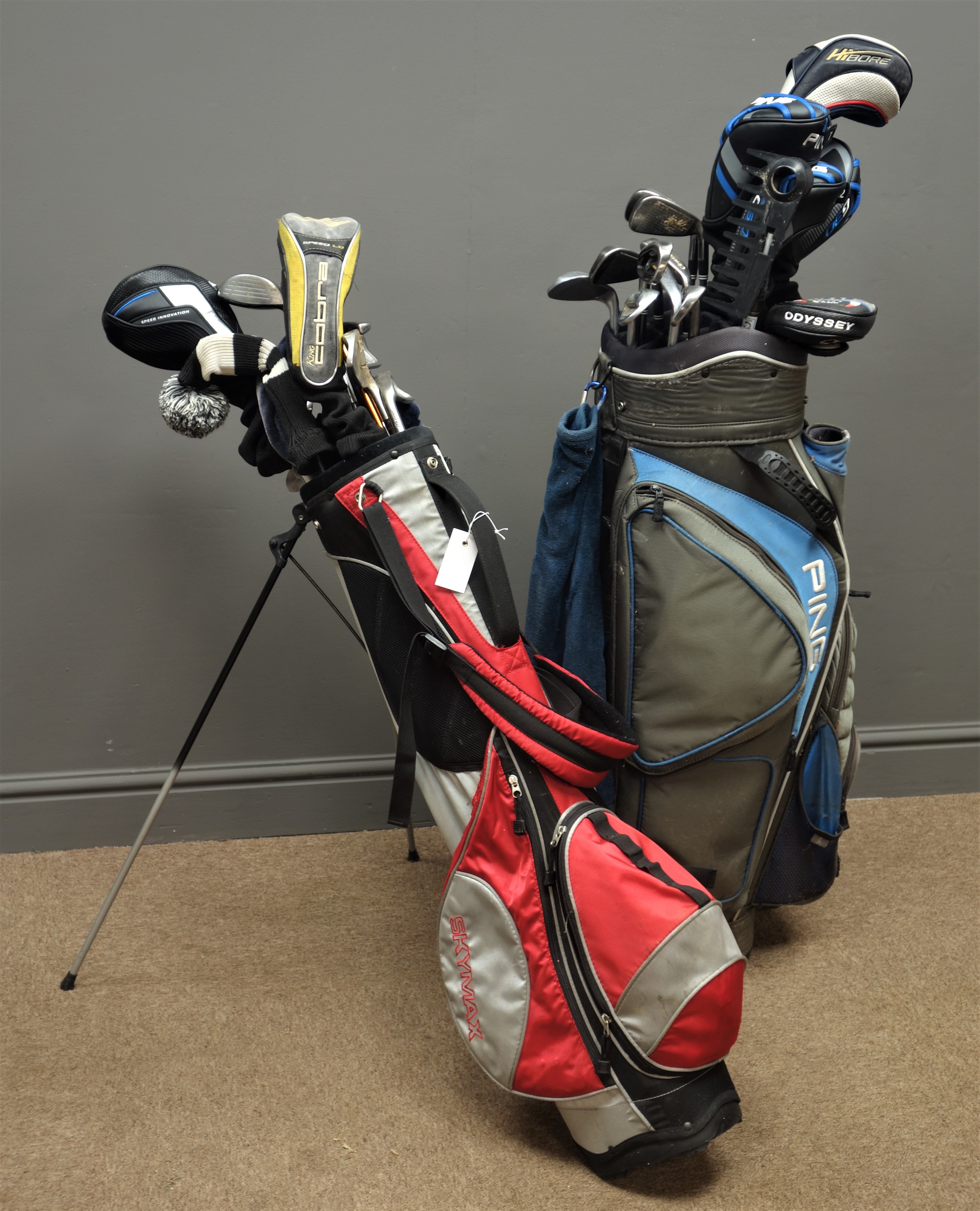 Mixed set of left handed golf clubs, one carry bag and one trolley bag