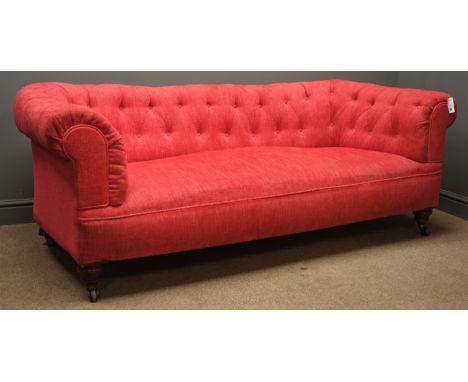 Early 20th century 'Howard & Co.' style walnut framed Chesterfield sofa, with turned front feet, upholstered in pink buttoned