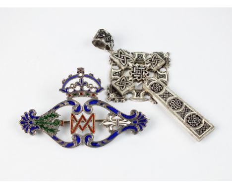 A Victorian polychrome enamel brooch, designed as a central monogram flanked to each side by a thistle and fleur de lys with 