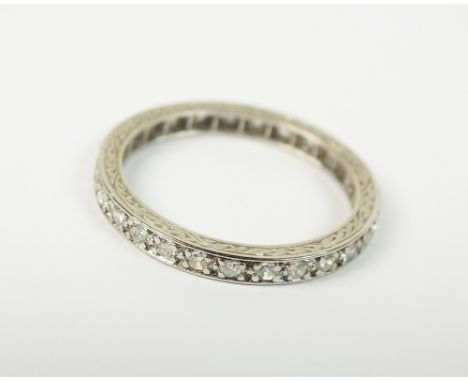 A diamond set full hoop eternity ring, the brilliant cut diamonds claw set in white metal, not stamped, weight 2.7gms