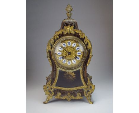 A 19th century French Boulle style mantel clock, the 3.5 inch dial with ring of Roman numerals in a balloon shaped case with 