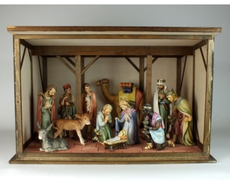 A Goebel Nativity Scene, mid-late 20th century, complete with twelve figures and a stable, printed factory marks (12)