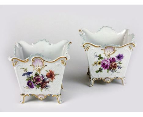 A pair of Meissen porcelain cache pot, 19th century, the rectangular forms painted with an array of flowers against a light r