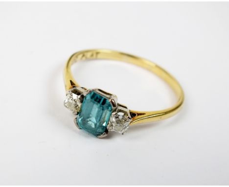 A three stone zircon and diamond ring, weight 2.7gms