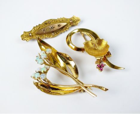 A 9ct gold opal floral spray brooch, together with an 18ct gold ruby brooch and a Victorian bar brooch (3)