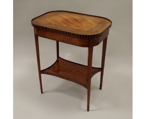 An early 19th century satinwood marquetry boxwood and ebony line strung crossbanded two tier occasional table, the rectangula