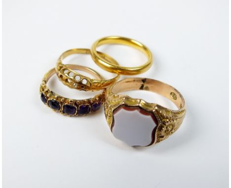 A 22ct gold plain polished wedding band, together with a hardstone set signet ring, an 18ct gold shank (lacking stones) and a