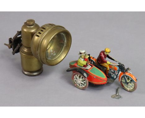 A lithographed tinplate clockwork-operated motorcycle &amp; sidecar, with key; &amp; a brass carbide bicycle lamp (No. 24), 1