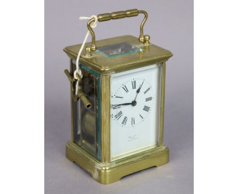 A French brass-cased carriage timepiece with black roman numerals to the white enamel dial signed “Mallory, Bath”, 13cm high.