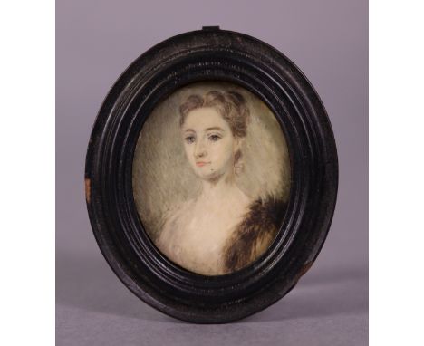 ENGLISH SCHOOL, 19th century. A portrait miniature of a lady 4cm x 3.5cm, on ivory, inscribed verso “Queen Mary…..” (the turn