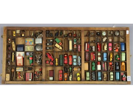 A collection of sixty various scale diecast &amp; other scale model vehicles; decorative ornaments, etc., all displayed in a 