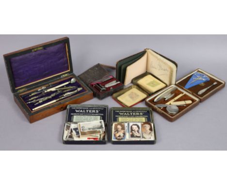 A vintage set of steel drawing implements in a mahogany case; a matched manicure set, cased; a vintage razor; a mid-20th cent
