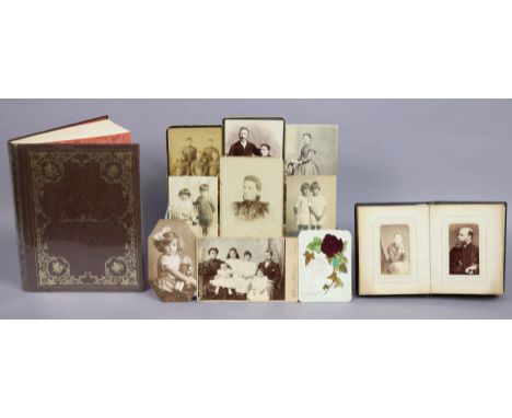 A collection of approximately thirty various vintage family photographs &amp; postcards, contained in one small album &amp; l