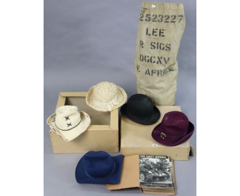 A British military army kit bag &amp; contents; together with a model aeroplane, boxed; &amp; five various vintage hats. 