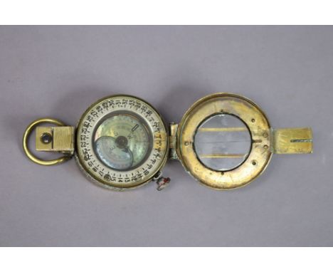 A WWII British military brass-cased pocket compass by T. G. &amp; Co. of London (MKIII). 