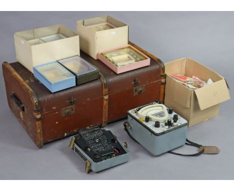 A vintage fibre-covered travelling trunk, 79cm wide; together with a vintage multimeter; various packets of drawing implement