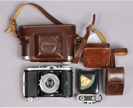 A vintage Balda folding camera; &amp; two light meters, each with case. 