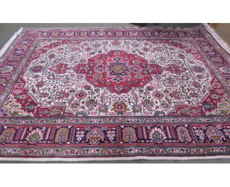 Good  Tabriz carpet, red ground central cream panel within multi border 340 cm x  240 cm